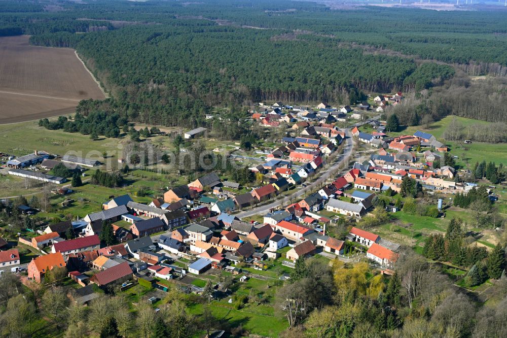 Stepenitz from above - Agricultural land and field boundaries surround the settlement area of the village in Stepenitz in the state Brandenburg, Germany