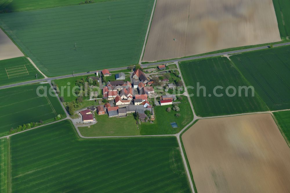 Stephansberg from above - Agricultural land and field boundaries surround the settlement area of the village in Stephansberg in the state Bavaria, Germany