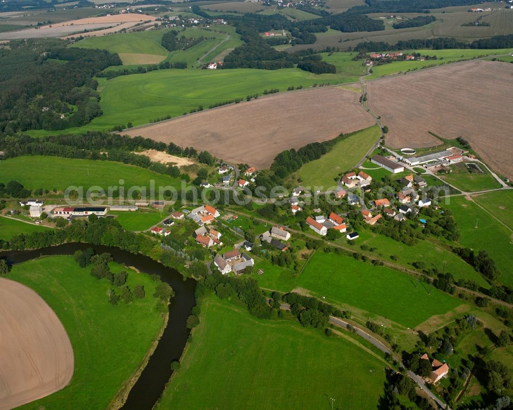 Aerial photograph Steudten - Agricultural land and field boundaries surround the settlement area of the village in Steudten in the state Saxony, Germany