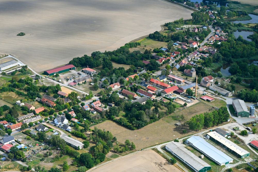 Aerial image Stöffin - Agricultural land and field boundaries surround the settlement area of the village in Stoeffin in the state Brandenburg, Germany