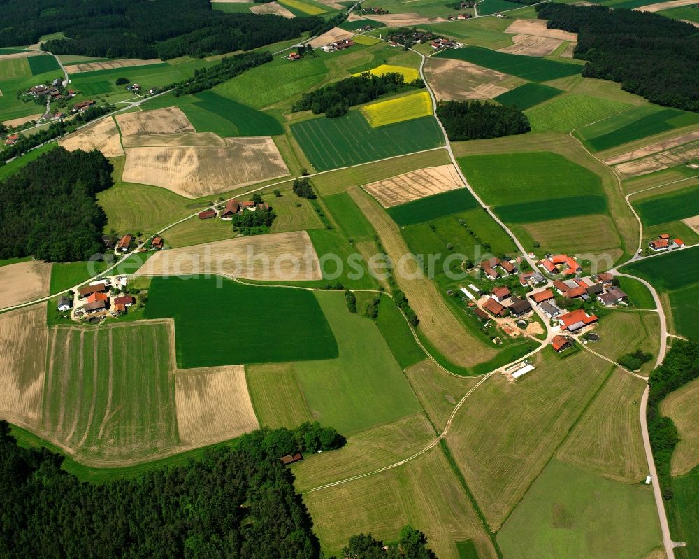 Stocka from above - Agricultural land and field boundaries surround the settlement area of the village in Stocka in the state Bavaria, Germany