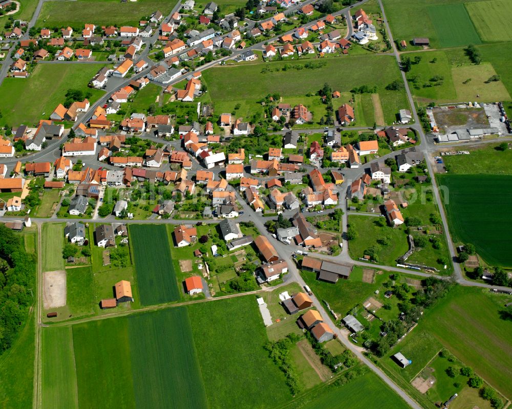 Aerial image Stockhausen - Agricultural land and field boundaries surround the settlement area of the village in Stockhausen in the state Hesse, Germany