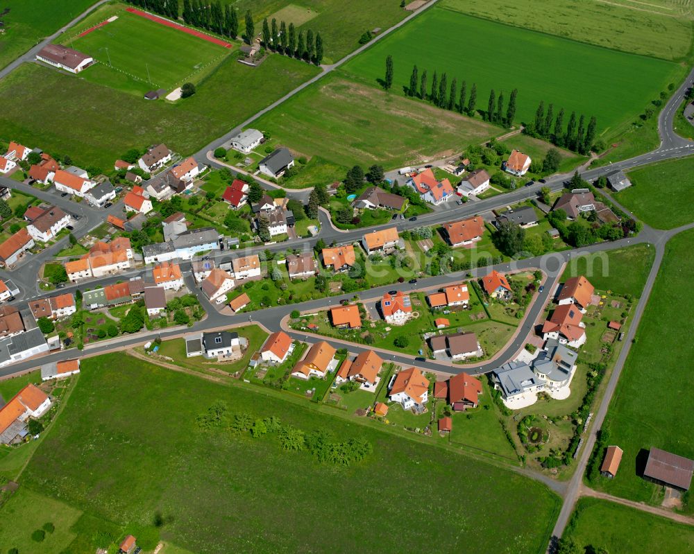 Aerial image Stockhausen - Agricultural land and field boundaries surround the settlement area of the village in Stockhausen in the state Hesse, Germany