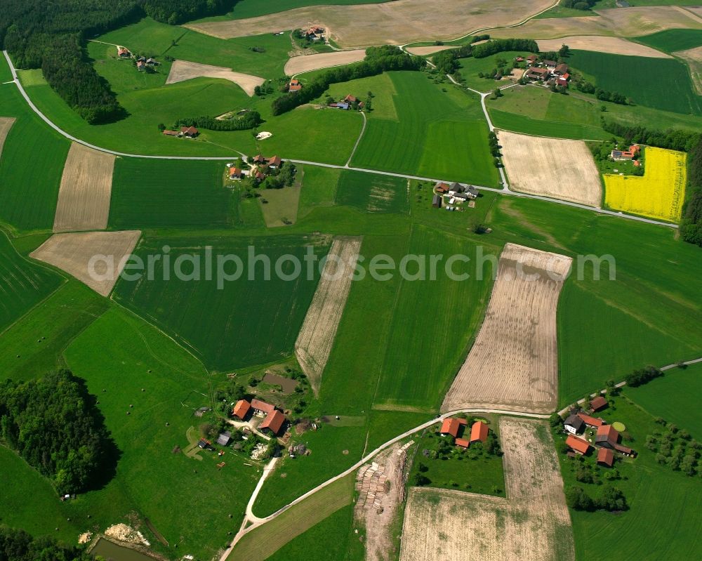 Stockland from above - Agricultural land and field boundaries surround the settlement area of the village in Stockland in the state Bavaria, Germany