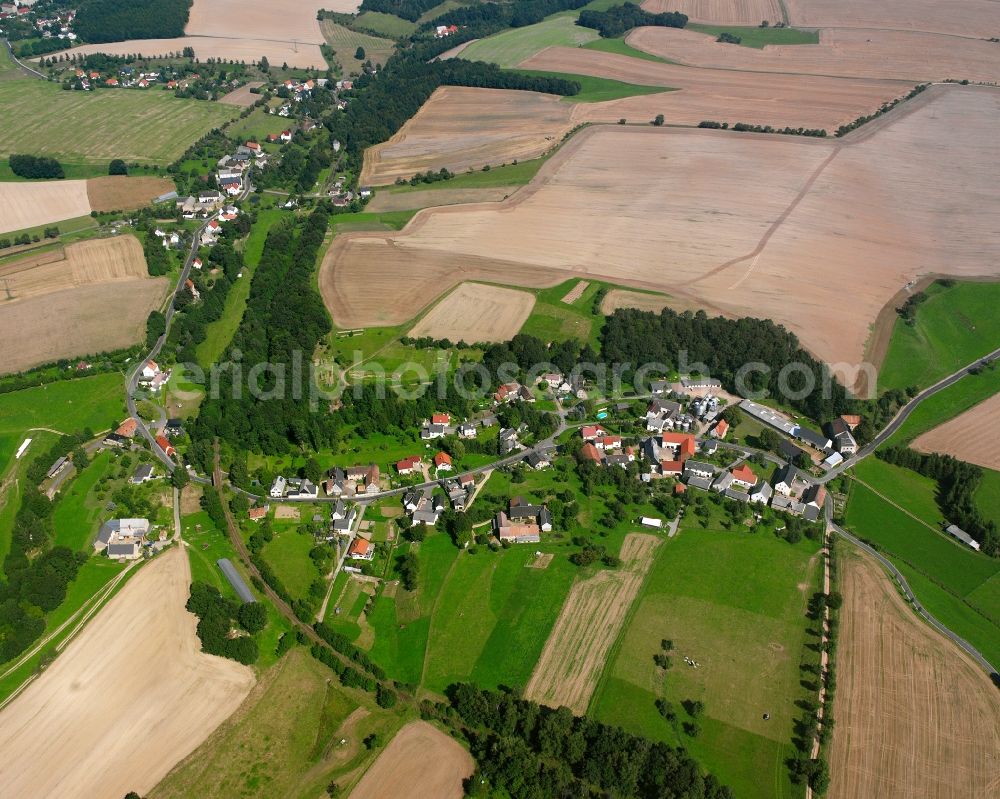 Aerial image Stollsdorf - Agricultural land and field boundaries surround the settlement area of the village in Stollsdorf in the state Saxony, Germany