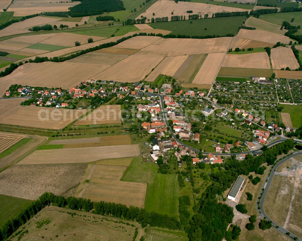 Aerial image Stolzenhain an der Röder - Agricultural land and field boundaries surround the settlement area of the village in Stolzenhain an der Röder in the state Saxony, Germany