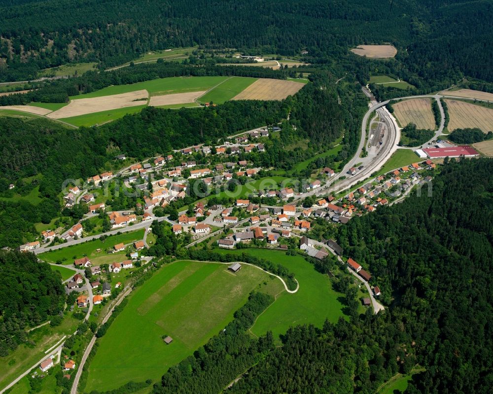 Aerial image Storzingen - Agricultural land and field boundaries surround the settlement area of the village in Storzingen in the state Baden-Wuerttemberg, Germany