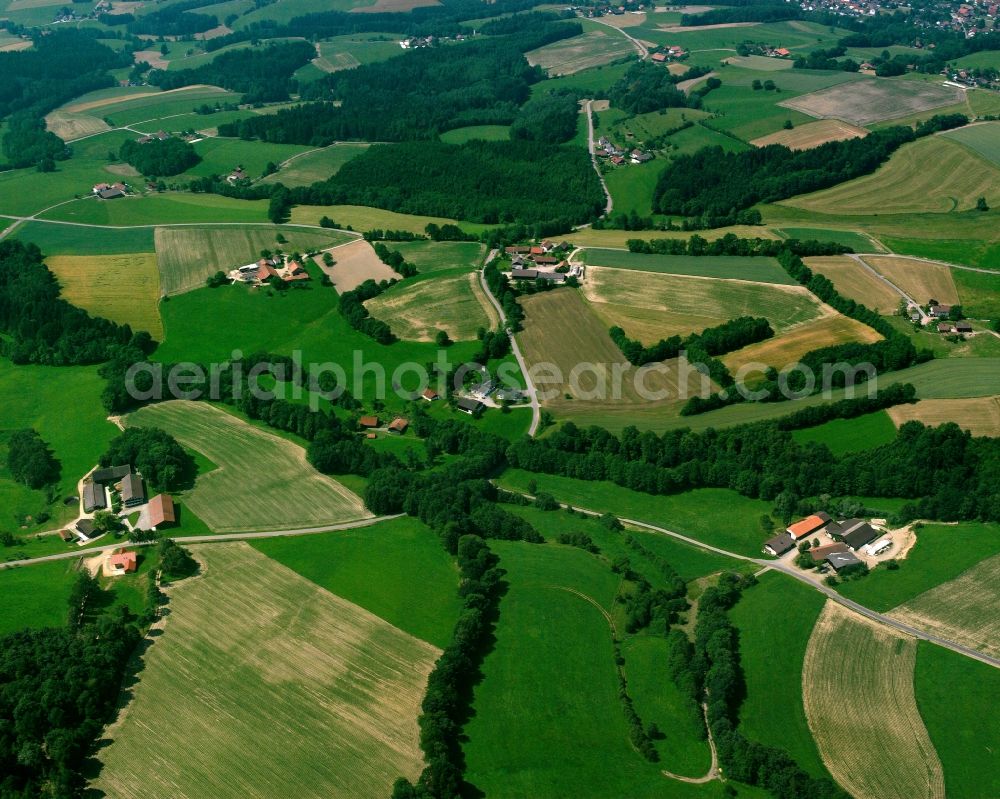 Strahberg from the bird's eye view: Agricultural land and field boundaries surround the settlement area of the village in Strahberg in the state Bavaria, Germany