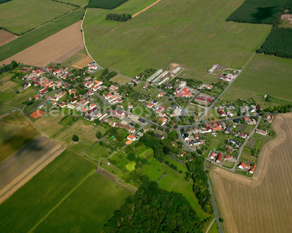 Aerial photograph Strauch - Agricultural land and field boundaries surround the settlement area of the village in Strauch in the state Saxony, Germany