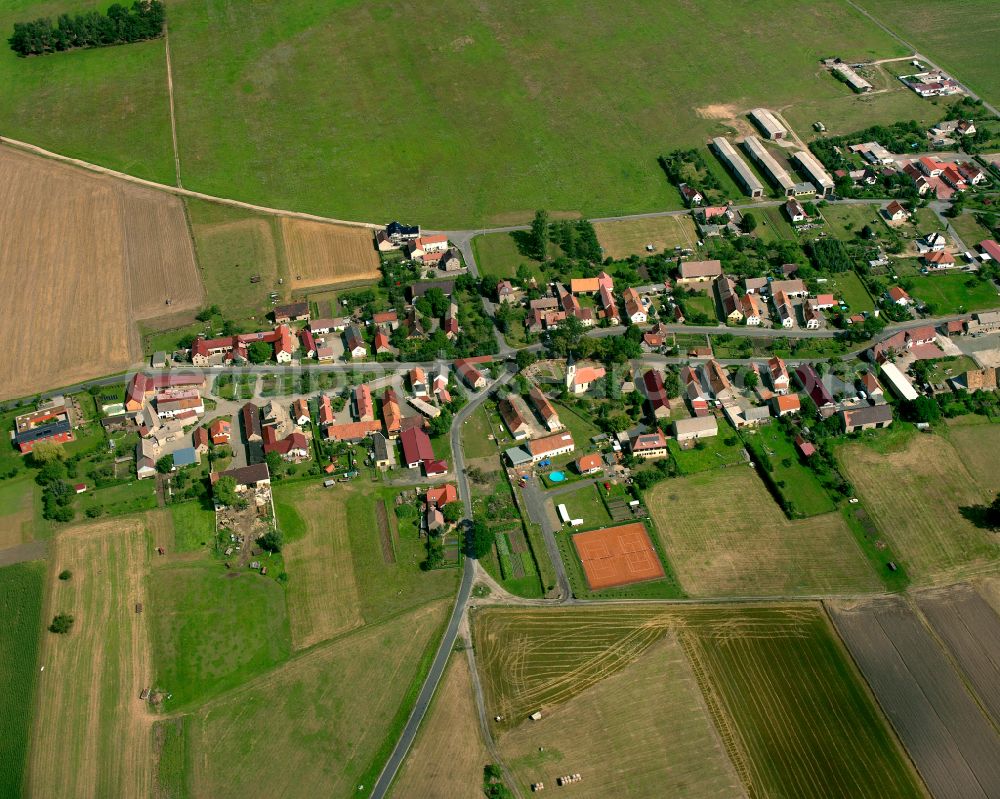 Strauch from the bird's eye view: Agricultural land and field boundaries surround the settlement area of the village in Strauch in the state Saxony, Germany