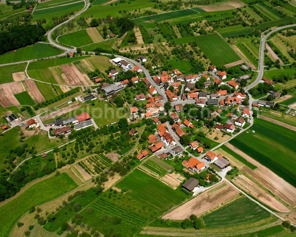 Streich from above - Agricultural land and field boundaries surround the settlement area of the village in Streich in the state Baden-Wuerttemberg, Germany