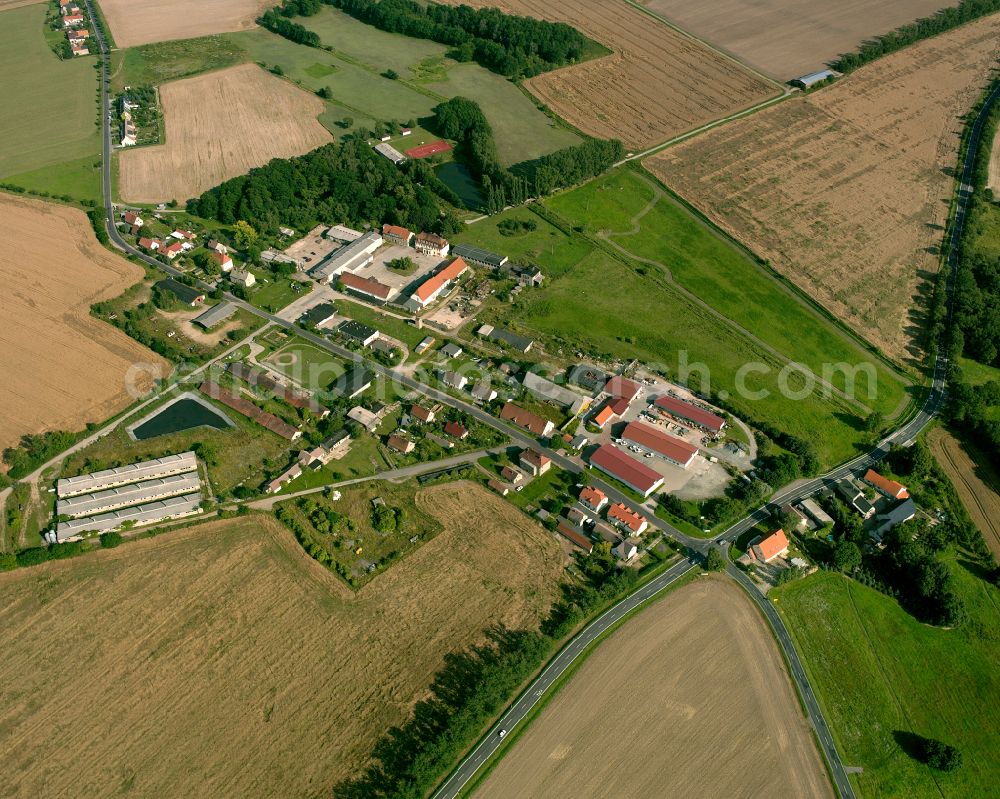 Stroga from the bird's eye view: Agricultural land and field boundaries surround the settlement area of the village in Stroga in the state Saxony, Germany