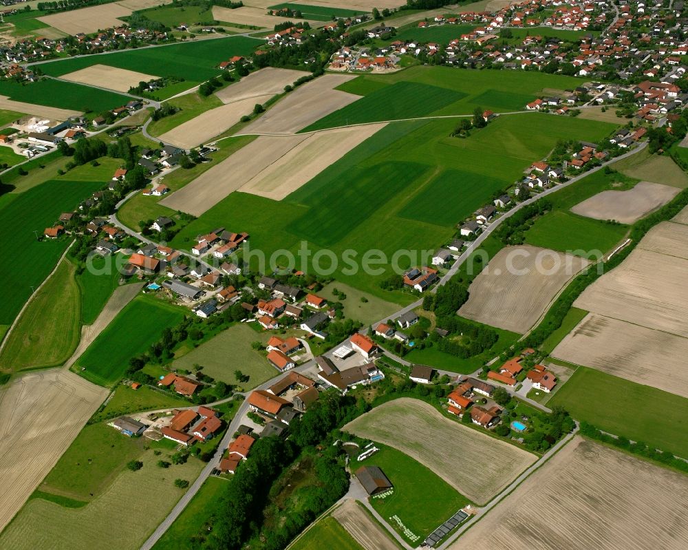 Strohham from the bird's eye view: Agricultural land and field boundaries surround the settlement area of the village in Strohham in the state Bavaria, Germany