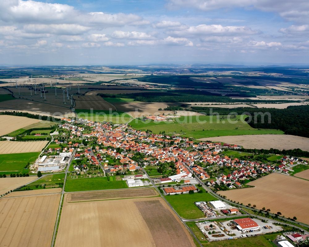 Struth from above - Agricultural land and field boundaries surround the settlement area of the village in Struth in the state Thuringia, Germany