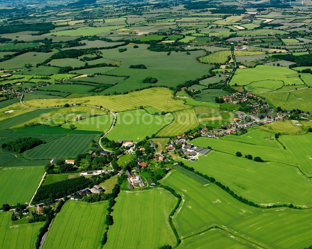 Aerial image Stubben - Agricultural land and field boundaries surround the settlement area of the village in Stubben in the state Schleswig-Holstein, Germany