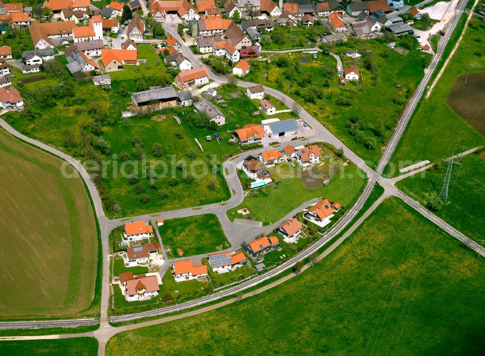 Stubersheim from the bird's eye view: Agricultural land and field boundaries surround the settlement area of the village in Stubersheim in the state Baden-Wuerttemberg, Germany