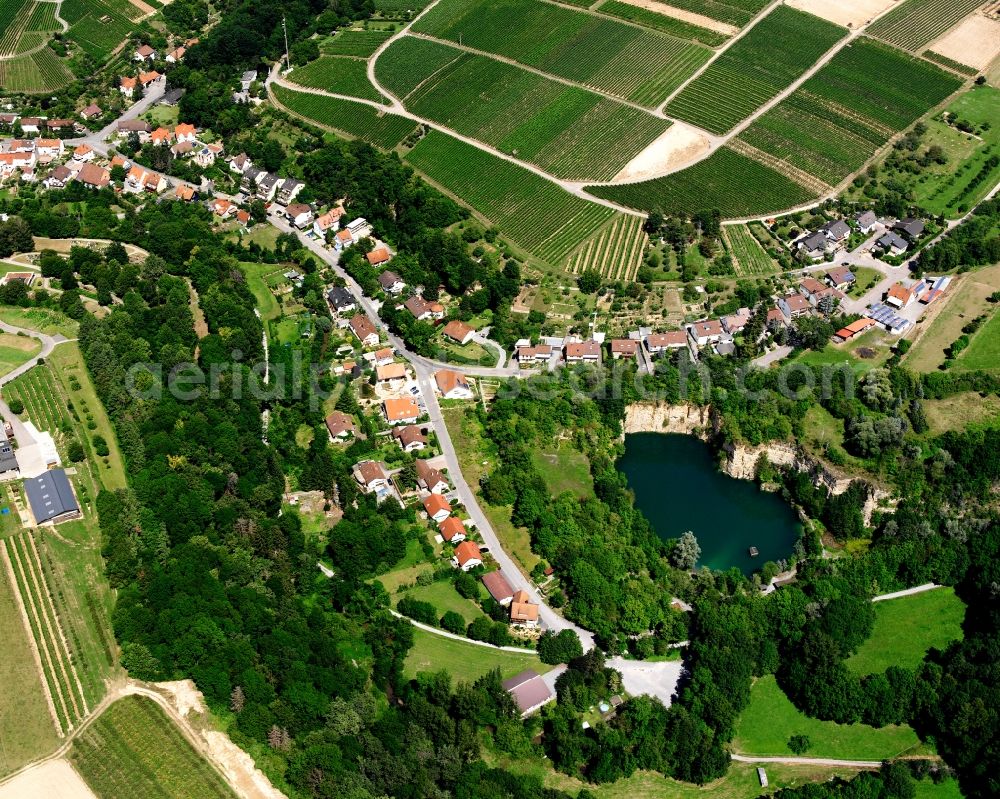 Aerial image Talheim - Agricultural land and field boundaries surround the settlement area of the village in Talheim in the state Baden-Wuerttemberg, Germany