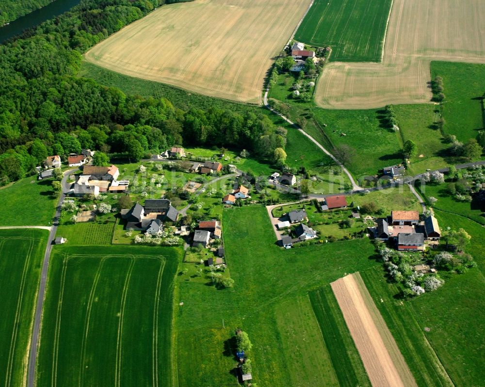 Aerial image Tanneberg - Agricultural land and field boundaries surround the settlement area of the village in Tanneberg in the state Saxony, Germany