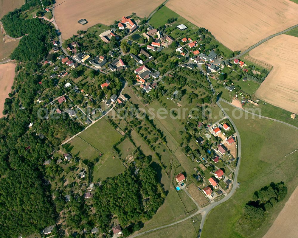 Taubenpreskeln from above - Agricultural land and field boundaries surround the settlement area of the village in Taubenpreskeln in the state Thuringia, Germany