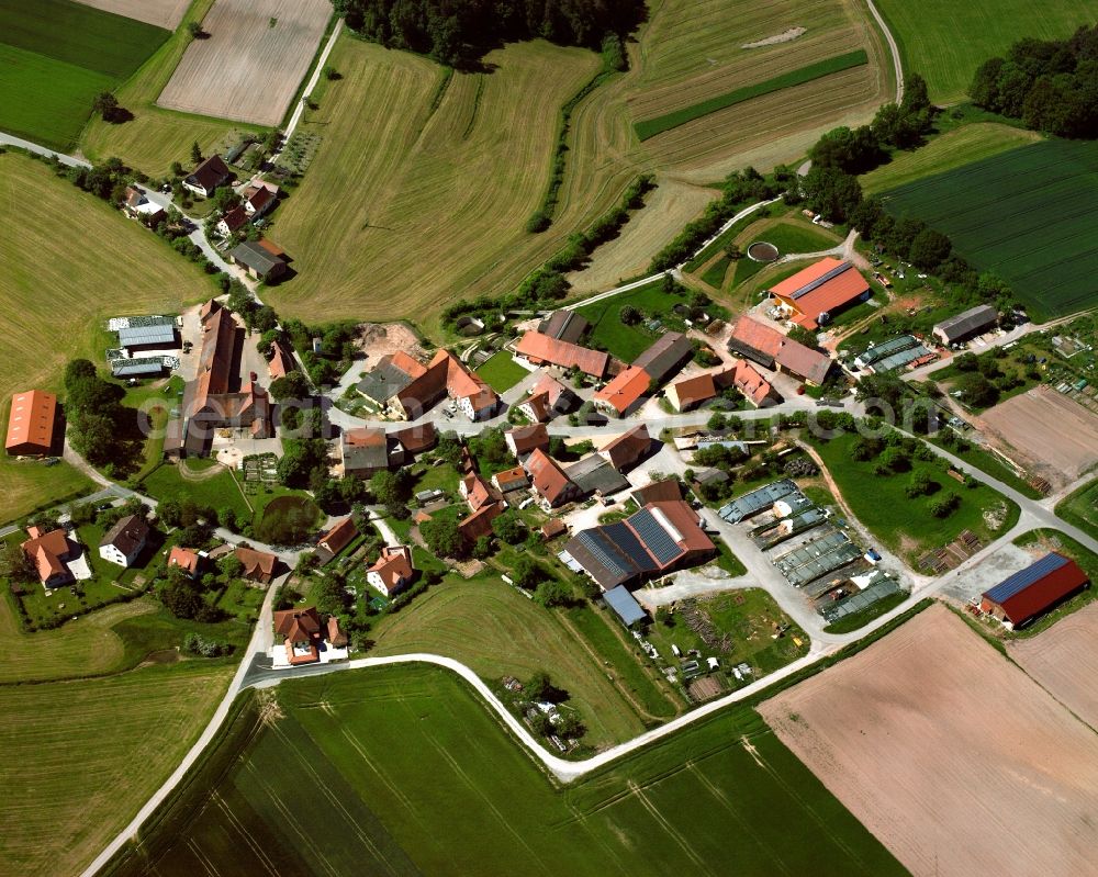 Aerial image Tauberschallbach - Agricultural land and field boundaries surround the settlement area of the village in Tauberschallbach in the state Bavaria, Germany