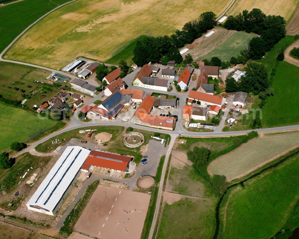 Aerial image Taugenroth - Agricultural land and field boundaries surround the settlement area of the village in Taugenroth in the state Bavaria, Germany