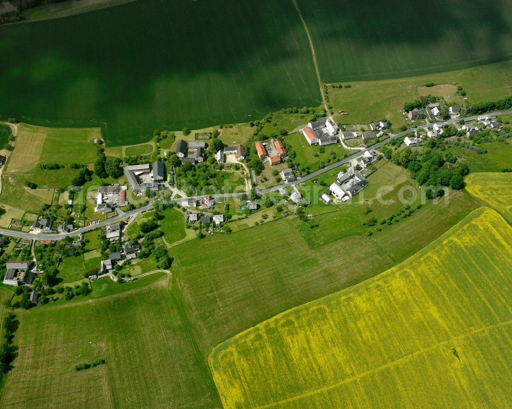 Teichwolframsdorf from above - Agricultural land and field boundaries surround the settlement area of the village in Teichwolframsdorf in the state Thuringia, Germany