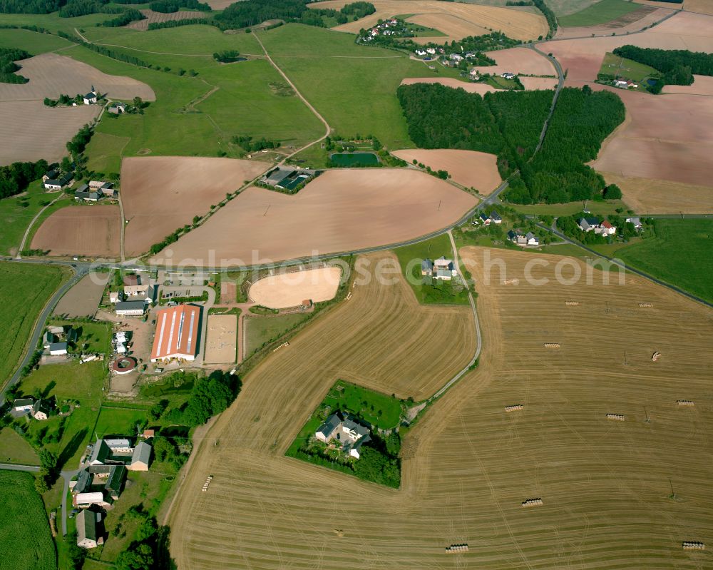 Teichwolframsdorf from above - Agricultural land and field boundaries surround the settlement area of the village in Teichwolframsdorf in the state Thuringia, Germany