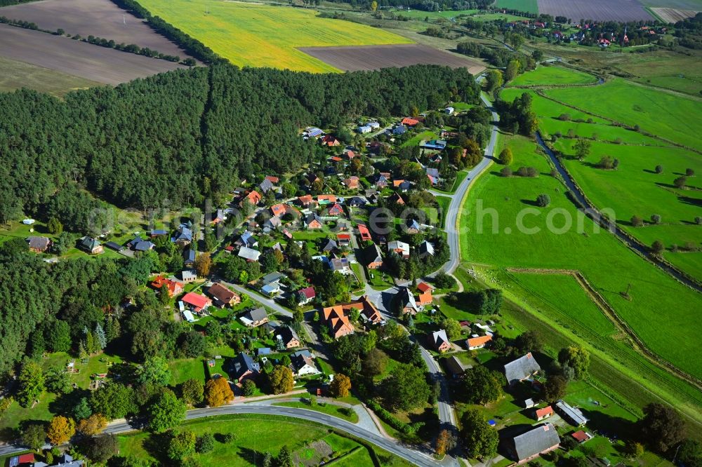 Teldau from above - Agricultural land and field boundaries surround the settlement area of the village in Teldau in the state Mecklenburg - Western Pomerania, Germany