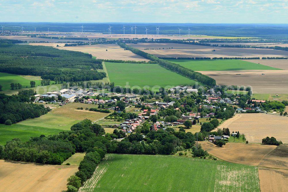 Tempelfelde from the bird's eye view: Agricultural land and field boundaries surround the settlement area of the village in Tempelfelde in the state Brandenburg, Germany