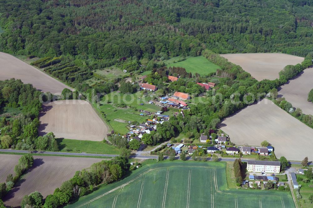 Tessenow from above - Agricultural land and field boundaries surround the settlement area of the village in Tessenow in the state Mecklenburg - Western Pomerania, Germany