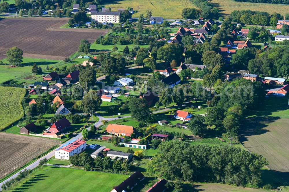 Tessenow from above - Agricultural land and field boundaries surround the settlement area of the village in Tessenow in the state Mecklenburg - Western Pomerania, Germany