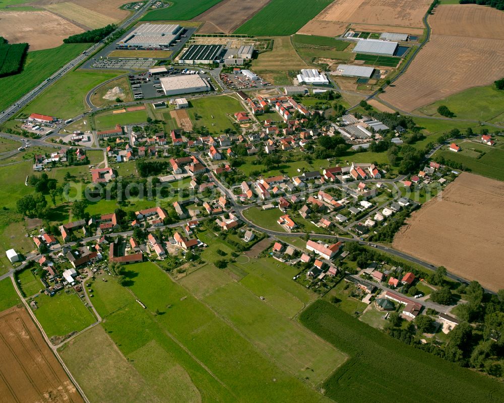 Aerial image Thiendorf - Agricultural land and field boundaries surround the settlement area of the village in Thiendorf in the state Saxony, Germany