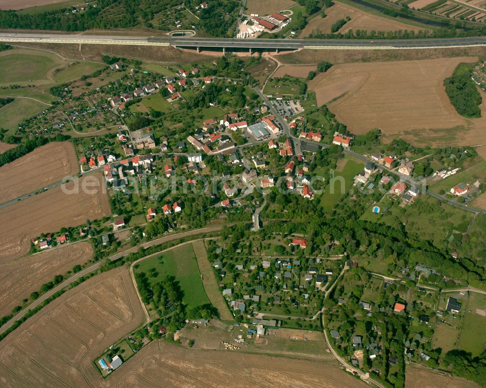 Aerial photograph Thieschitz - Agricultural land and field boundaries surround the settlement area of the village in Thieschitz in the state Thuringia, Germany