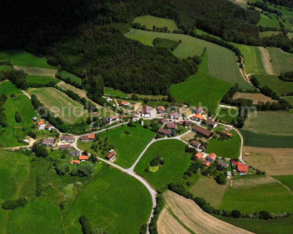 Thurasdorf from the bird's eye view: Agricultural land and field boundaries surround the settlement area of the village in Thurasdorf in the state Bavaria, Germany