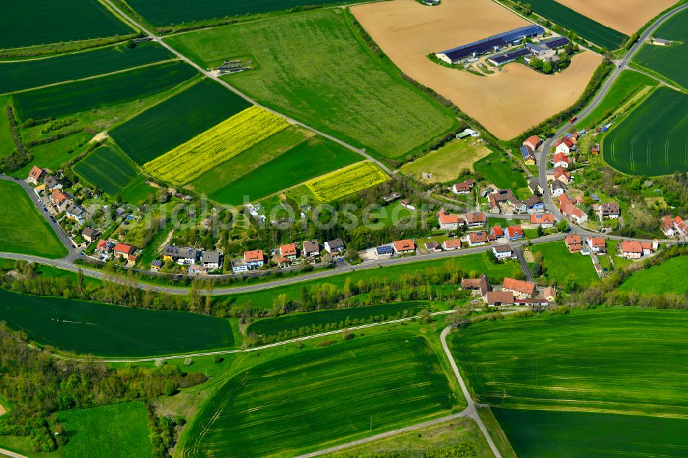 Tiefenstockheim from the bird's eye view: Agricultural land and field boundaries surround the settlement area of the village in Tiefenstockheim in the state Bavaria, Germany