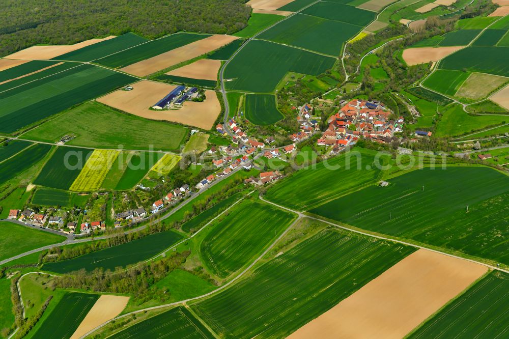 Aerial image Tiefenstockheim - Agricultural land and field boundaries surround the settlement area of the village in Tiefenstockheim in the state Bavaria, Germany