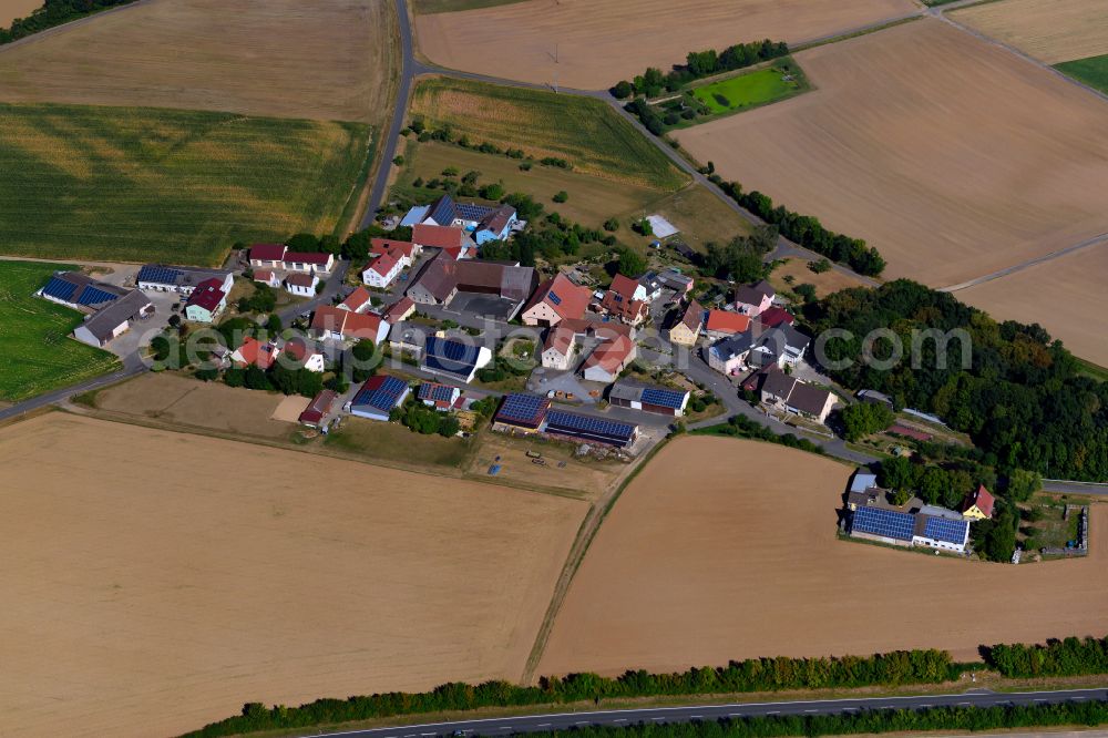 Tiefenthal from above - Agricultural land and field boundaries surround the settlement area of the village in Tiefenthal in the state Bavaria, Germany