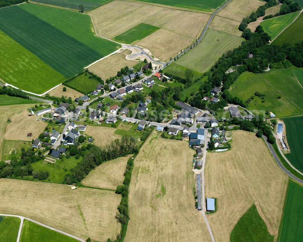 Todenroth from above - Agricultural land and field boundaries surround the settlement area of the village in Todenroth in the state Rhineland-Palatinate, Germany