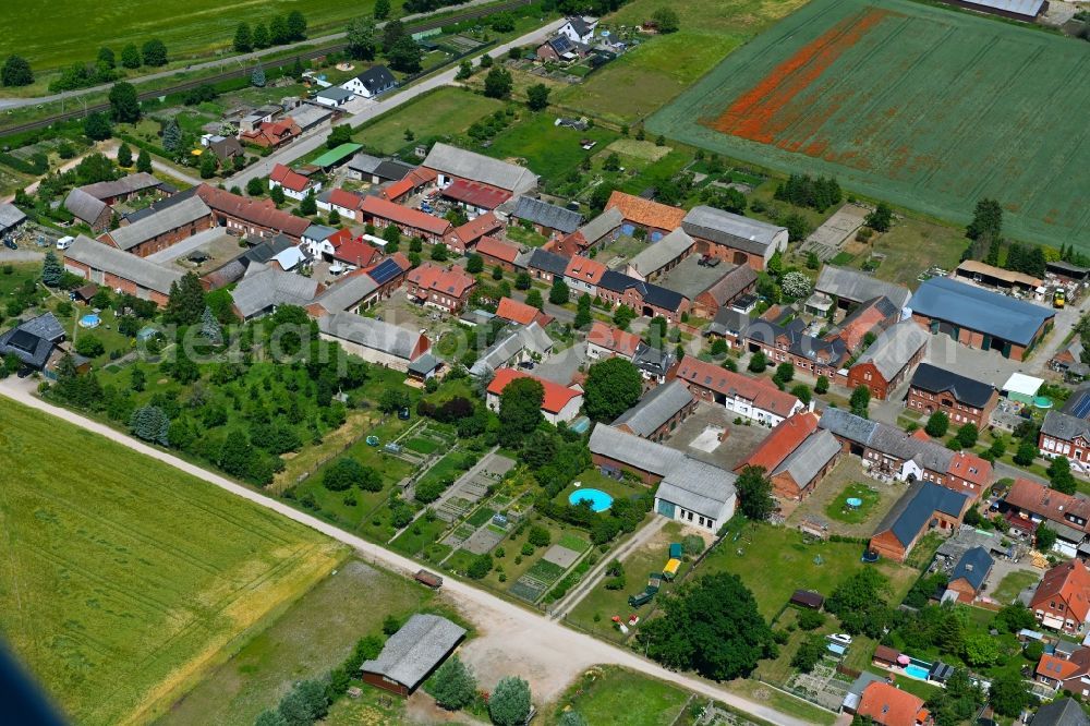 Aerial image Tornau - Agricultural land and field boundaries surround the settlement area of the village in Tornau in the state Saxony-Anhalt, Germany