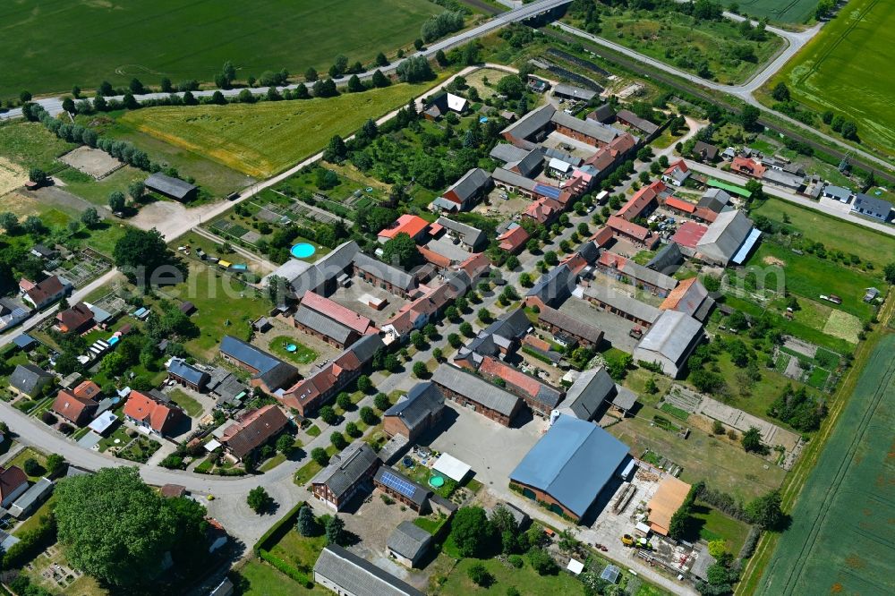 Aerial image Tornau - Agricultural land and field boundaries surround the settlement area of the village in Tornau in the state Saxony-Anhalt, Germany