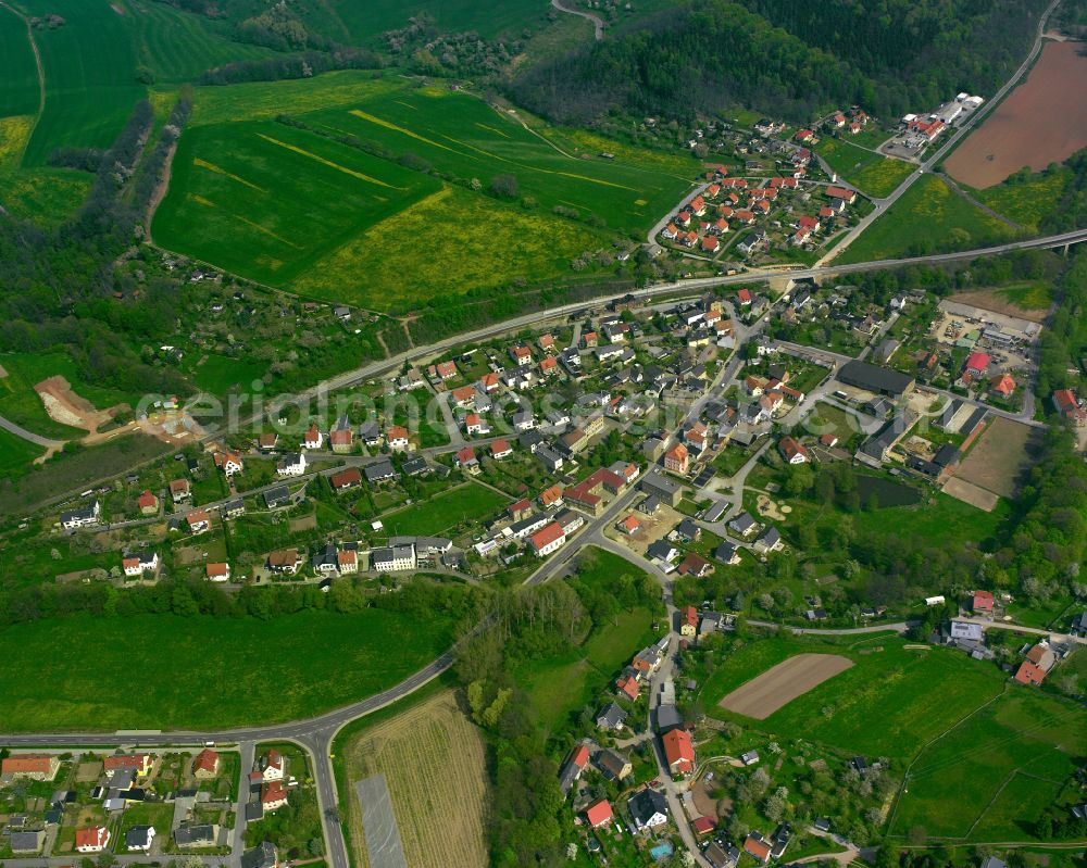 Töppeln from above - Agricultural land and field boundaries surround the settlement area of the village in Töppeln in the state Thuringia, Germany