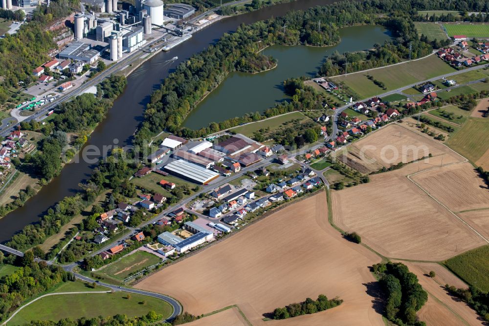 Trennfeld from the bird's eye view: Agricultural land and field boundaries surround the settlement area of the village in Trennfeld in the state Bavaria, Germany