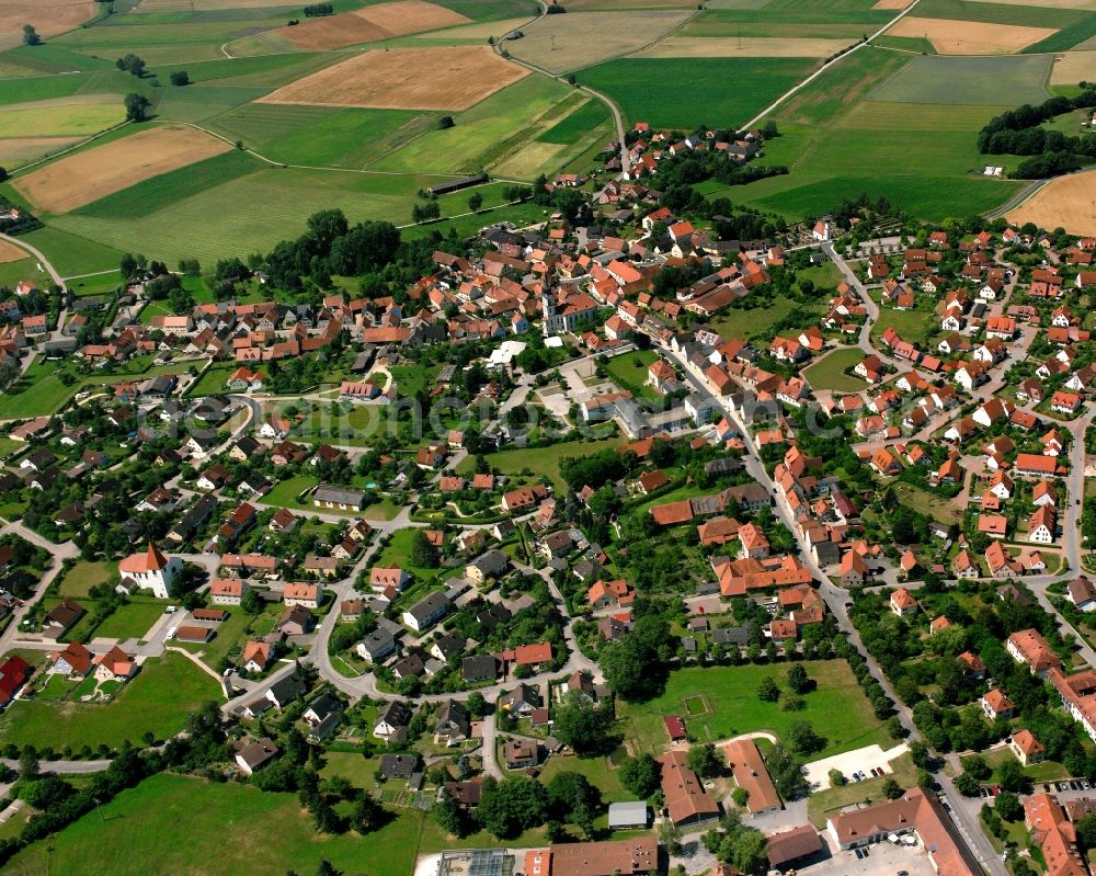 Triesdorf from the bird's eye view: Agricultural land and field boundaries surround the settlement area of the village in Triesdorf in the state Bavaria, Germany