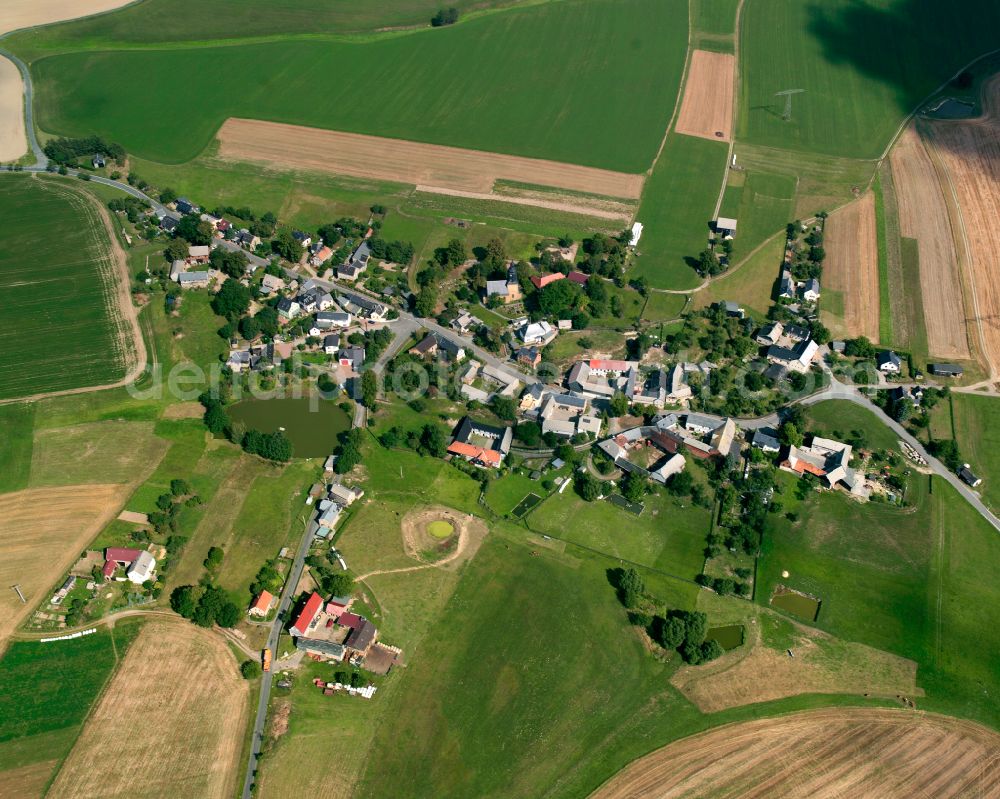 Tschirma from above - Agricultural land and field boundaries surround the settlement area of the village in Tschirma in the state Thuringia, Germany