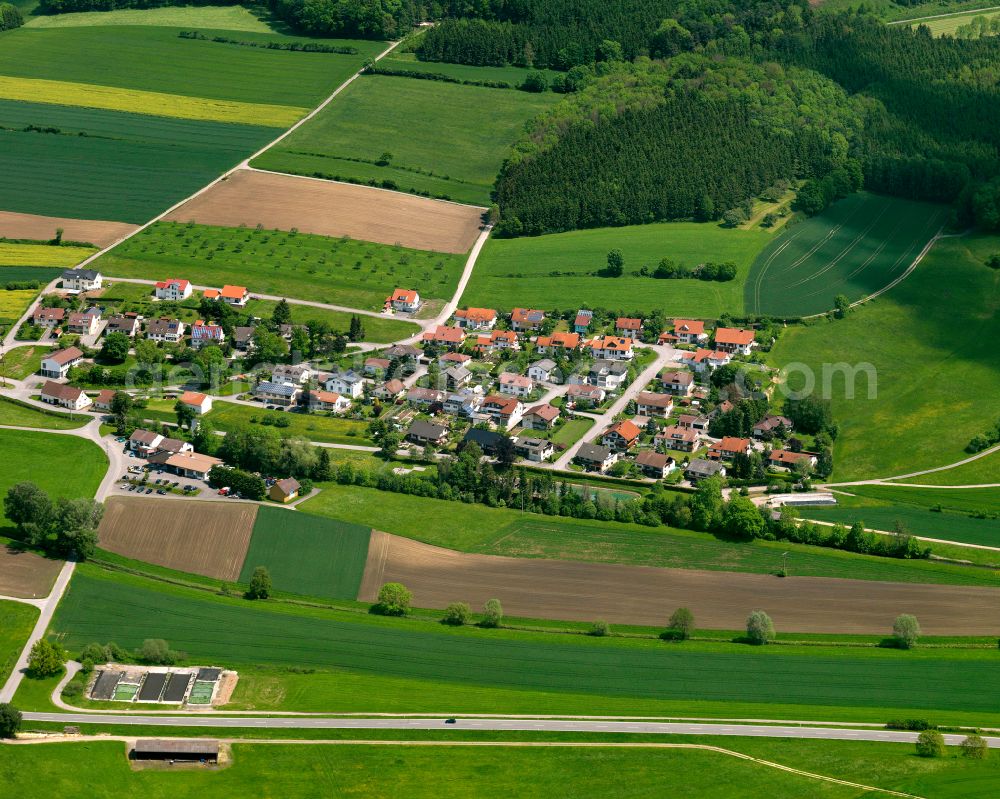 Unlingen from above - Agricultural land and field boundaries surround the settlement area of the village in Unlingen in the state Baden-Wuerttemberg, Germany