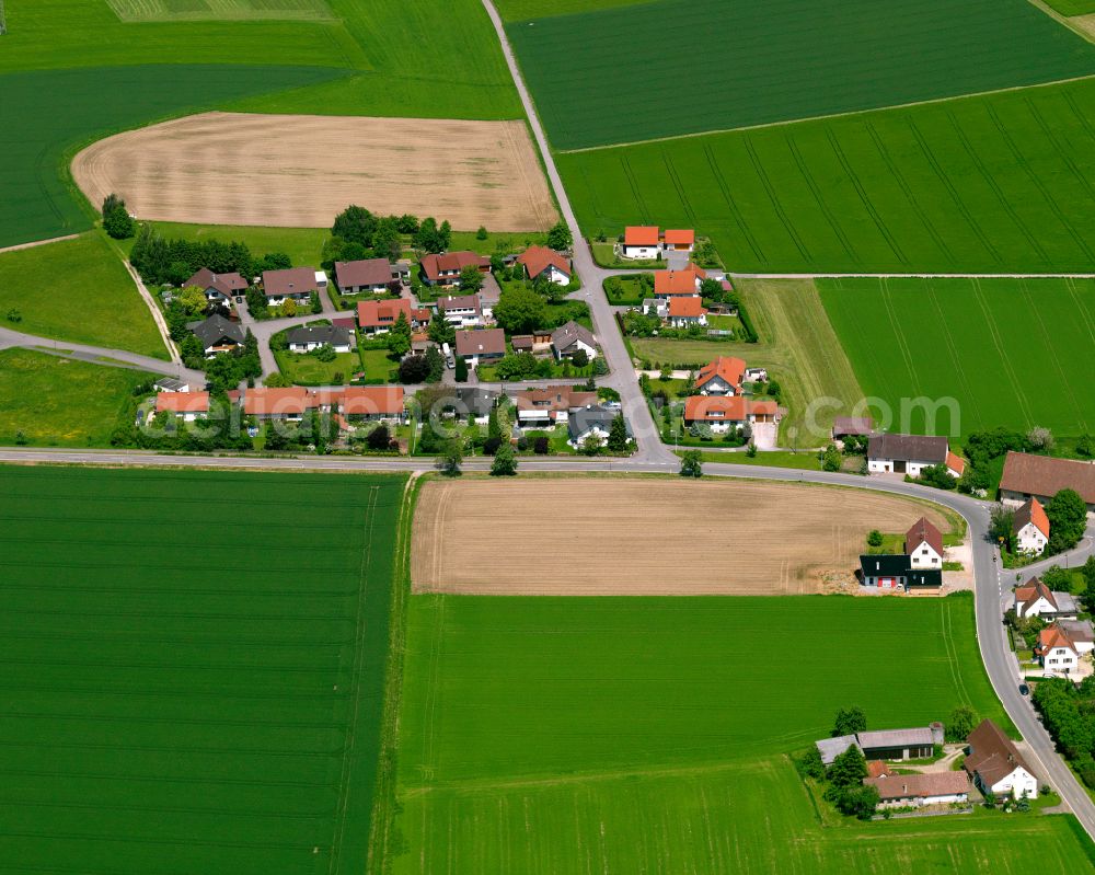 Unlingen from the bird's eye view: Agricultural land and field boundaries surround the settlement area of the village in Unlingen in the state Baden-Wuerttemberg, Germany