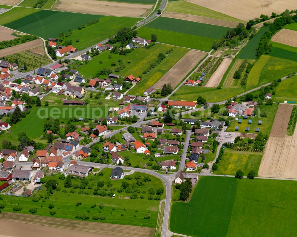 Unlingen from above - Agricultural land and field boundaries surround the settlement area of the village in Unlingen in the state Baden-Wuerttemberg, Germany