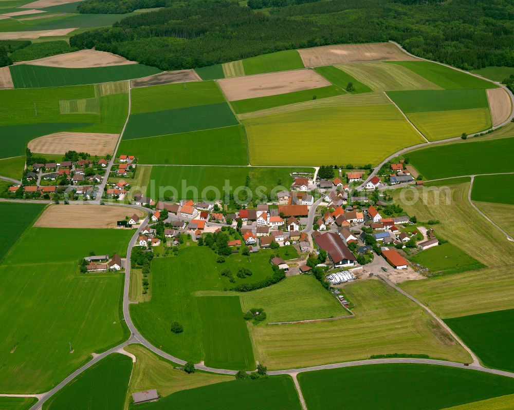 Unlingen from above - Agricultural land and field boundaries surround the settlement area of the village in Unlingen in the state Baden-Wuerttemberg, Germany