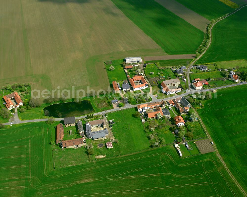 Untendorf from above - Agricultural land and field boundaries surround the settlement area of the village in Untendorf in the state Thuringia, Germany