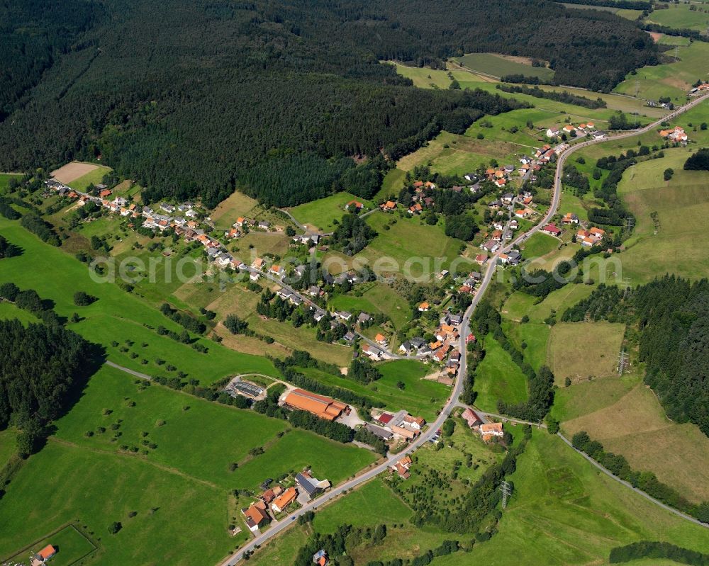 Unter-Mossau from above - Agricultural land and field boundaries surround the settlement area of the village in Unter-Mossau in the state Hesse, Germany